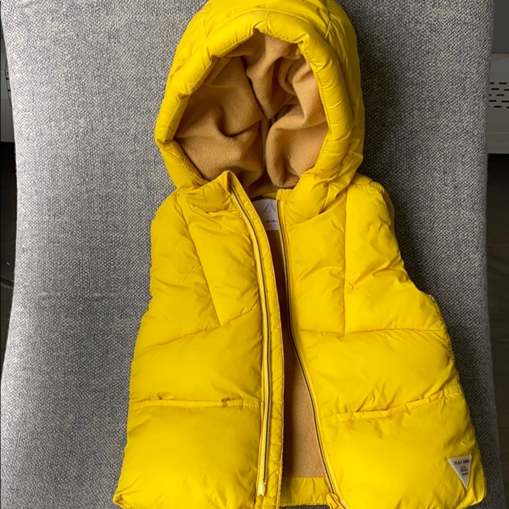 Yellow puffer vest . Gender neutral